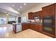 Open concept kitchen with granite countertops, stainless steel appliances, and tile flooring at 11625 Cabo Del Verde Ave, Las Vegas, NV 89138