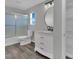 Bathroom showcasing a shower-tub combo, stylish vanity, and a shelved linen closet at 11787 Fern Creek Ln, Las Vegas, NV 89183