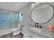 Bathroom with a shower-tub, marble countertop vanity, stylish mirror, and chrome hardware at 11787 Fern Creek Ln, Las Vegas, NV 89183