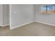 Neutral bedroom with tile floors and a window offering plenty of natural light at 11787 Fern Creek Ln, Las Vegas, NV 89183