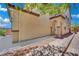 Charming two-story home featuring a welcoming entrance with a quaint, covered porch and brick-paved walkway at 11787 Fern Creek Ln, Las Vegas, NV 89183