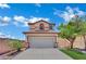 Charming two-story home with a tan exterior, tile roof, and an attached two-car garage at 11787 Fern Creek Ln, Las Vegas, NV 89183