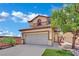 Charming two-story home with a tan exterior, tile roof, and an attached two-car garage at 11787 Fern Creek Ln, Las Vegas, NV 89183
