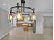 Open kitchen with stainless appliances, central island, and adjacent dining area at 11787 Fern Creek Ln, Las Vegas, NV 89183