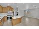 Open layout kitchen with stainless appliances and dining area at 11787 Fern Creek Ln, Las Vegas, NV 89183