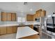 Bright kitchen with stainless steel appliances and wood cabinets at 11787 Fern Creek Ln, Las Vegas, NV 89183