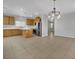 Open kitchen featuring stainless steel appliances and tile flooring at 11787 Fern Creek Ln, Las Vegas, NV 89183