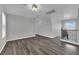 Spacious living room with wood floors and a staircase at 11787 Fern Creek Ln, Las Vegas, NV 89183