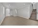 Spacious living room with tile flooring, recessed lighting, and a staircase at 11787 Fern Creek Ln, Las Vegas, NV 89183