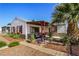 Front yard with a covered porch and attractive landscaping at 123 Cedar St, Henderson, NV 89015