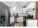 Bright kitchen featuring butcher block counters, subway tile backsplash, and stainless steel appliances at 123 Cedar St, Henderson, NV 89015