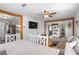Open-concept living room with wood accents, large TV, modern furnishings, and seamless flow to kitchen and hallway at 123 Cedar St, Henderson, NV 89015