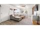 Bright and open living room featuring a sectional sofa, a dining area, and stylish decor at 123 Cedar St, Henderson, NV 89015