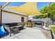 Cozy outdoor patio with seating and grill, perfect for entertaining in the backyard at 123 Cedar St, Henderson, NV 89015