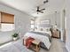 Bright and airy bedroom showcasing modern decor, plush carpeting, and a comfortable king-sized bed at 12565 Huckleberry Oak Ave, Las Vegas, NV 89138