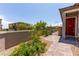 Inviting entrance with red door and landscaped pathway at 12565 Huckleberry Oak Ave, Las Vegas, NV 89138