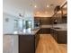 Kitchen featuring granite countertops, stainless appliances, and an island, seamlessly connecting to the living area at 12565 Huckleberry Oak Ave, Las Vegas, NV 89138