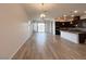 Open-concept living space featuring wood flooring, recessed lighting and access to the dining and kitchen areas at 12565 Huckleberry Oak Ave, Las Vegas, NV 89138