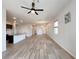 Spacious open-concept living space with wood flooring, recessed lighting, and ample natural light at 12565 Huckleberry Oak Ave, Las Vegas, NV 89138