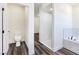 Modern bathroom showcasing a sleek toilet, glass-enclosed shower, and a luxurious soaking tub at 1351 Huckleberry St, Pahrump, NV 89048