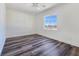 Bright, airy bedroom featuring neutral walls, modern flooring, and a large window at 1351 Huckleberry St, Pahrump, NV 89048