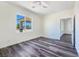 Serene bedroom with natural light, sleek flooring, and a view of the outdoors at 1351 Huckleberry St, Pahrump, NV 89048