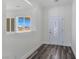Bright entryway featuring decorative front door, wood-look flooring and view of the outdoors at 1351 Huckleberry St, Pahrump, NV 89048
