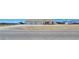 Single-story home boasts a three-car garage and spacious surrounding land at 1351 Huckleberry St, Pahrump, NV 89048