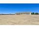 Exterior of the home showing the surrounding landscape at 1351 Huckleberry St, Pahrump, NV 89048