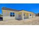 Exterior view of the home, showing the covered patio and large yard at 1351 Huckleberry St, Pahrump, NV 89048