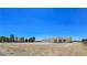 Expansive single-story home with a three-car garage on a large, mostly cleared lot at 1351 Huckleberry St, Pahrump, NV 89048