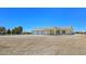 Single-story home with three-car garage offering ample parking and generous land area at 1351 Huckleberry St, Pahrump, NV 89048