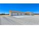 Attached three-car garage with white doors offers convenient parking and storage at 1351 Huckleberry St, Pahrump, NV 89048