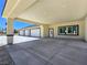 Attached three-car garage with a covered entrance provides ample parking and shelter at 1351 Huckleberry St, Pahrump, NV 89048