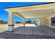 Covered entrance with columns reveals a three-car garage and a picturesque vista at 1351 Huckleberry St, Pahrump, NV 89048