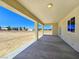 Covered patio with outdoor lighting, connecting to the yard through the glass doors and featuring a window at 1351 Huckleberry St, Pahrump, NV 89048
