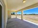 Spacious covered patio area with open view to large property lot at 1351 Huckleberry St, Pahrump, NV 89048