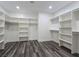 Large walk-in closet with custom shelving and wooden floors at 1351 Huckleberry St, Pahrump, NV 89048