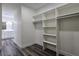 View of walk-in closet leading to primary bathroom at 1351 Huckleberry St, Pahrump, NV 89048