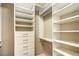 Well-organized walk-in closet with custom shelving and drawers for optimal storage at 1448 Canyon Ledge Ct, Las Vegas, NV 89117