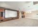 Entertainment room complete with large screen, built-in speakers and custom cabinets at 1448 Canyon Ledge Ct, Las Vegas, NV 89117