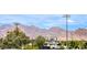 Scenic view showcasing mountains, buildings and lush greenery on a bright sunny day at 1448 Canyon Ledge Ct, Las Vegas, NV 89117