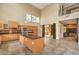 Open concept living space featuring a sleek kitchen and a mezzanine at 1448 Canyon Ledge Ct, Las Vegas, NV 89117