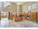 Open concept living space featuring a sleek kitchen and access to the pool at 1448 Canyon Ledge Ct, Las Vegas, NV 89117