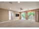 Large living room with a balcony, providing an open and airy space for relaxation at 1448 Canyon Ledge Ct, Las Vegas, NV 89117