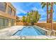 Beautiful backyard view showcasing a sparkling swimming pool, patio and desert landscaping at 1448 Canyon Ledge Ct, Las Vegas, NV 89117