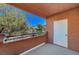 Private balcony offers views of lush landscaping and a blue sky at 1505 Blackcombe St # 202, Las Vegas, NV 89128