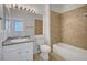 Well-lit bathroom featuring a shower-tub combo and a granite countertop vanity at 1505 Blackcombe St # 202, Las Vegas, NV 89128