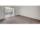 Bright bedroom with neutral carpeting and sliding glass doors leading to a balcony for outdoor relaxation at 1505 Blackcombe St # 202, Las Vegas, NV 89128