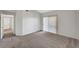 Carpeted bedroom featuring sliding glass doors, providing ample natural light and access to outdoor views at 1505 Blackcombe St # 202, Las Vegas, NV 89128